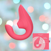 A Womanizer Blend Air-Pulse Clit Stimulator Vibrant Rose massager set against a blurred colorful background. The ergonomic design features an insertable section and a separate external part, making it ideal for blended orgasms. In the bottom right corner, there is a smaller image showing the Womanizer packaging.